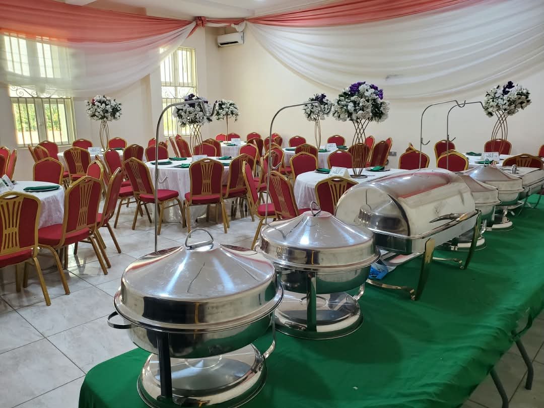 Conference Hall 2 set with round tables and a buffet