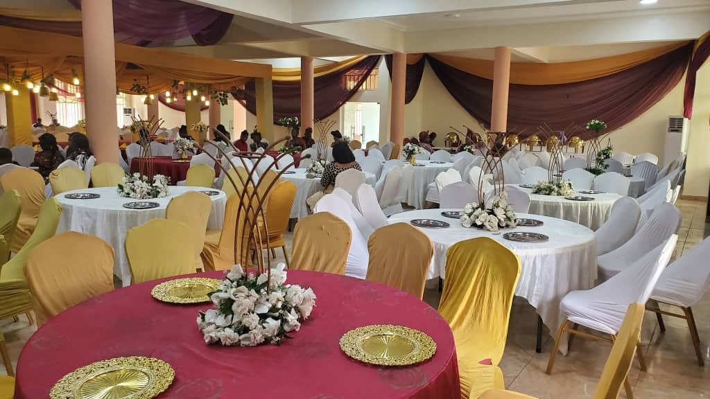 Round tables with gold chair covers
