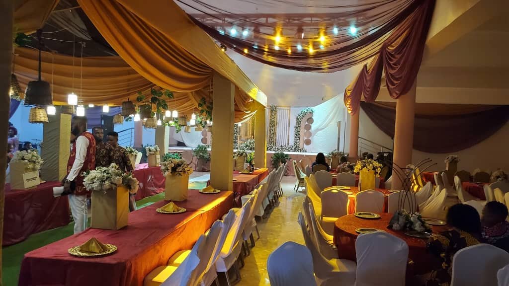Main Auditorium dressed with orange and burgundy drapes