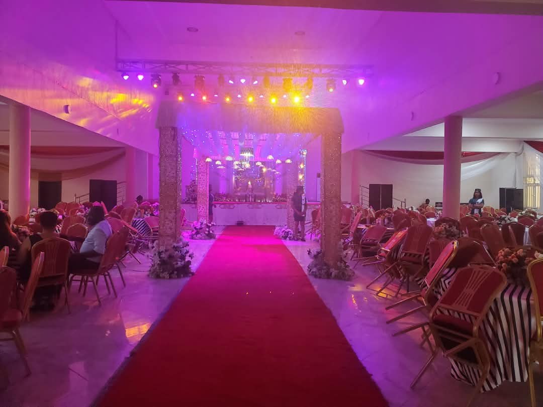 Main Auditorium with red carpet aisle and stage lights