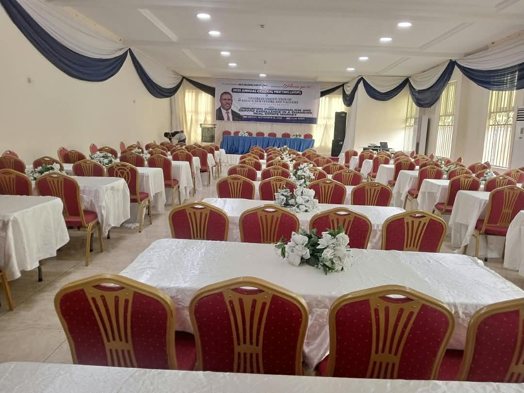 Mini Auditorium set with tables and red chairs for a meeting
