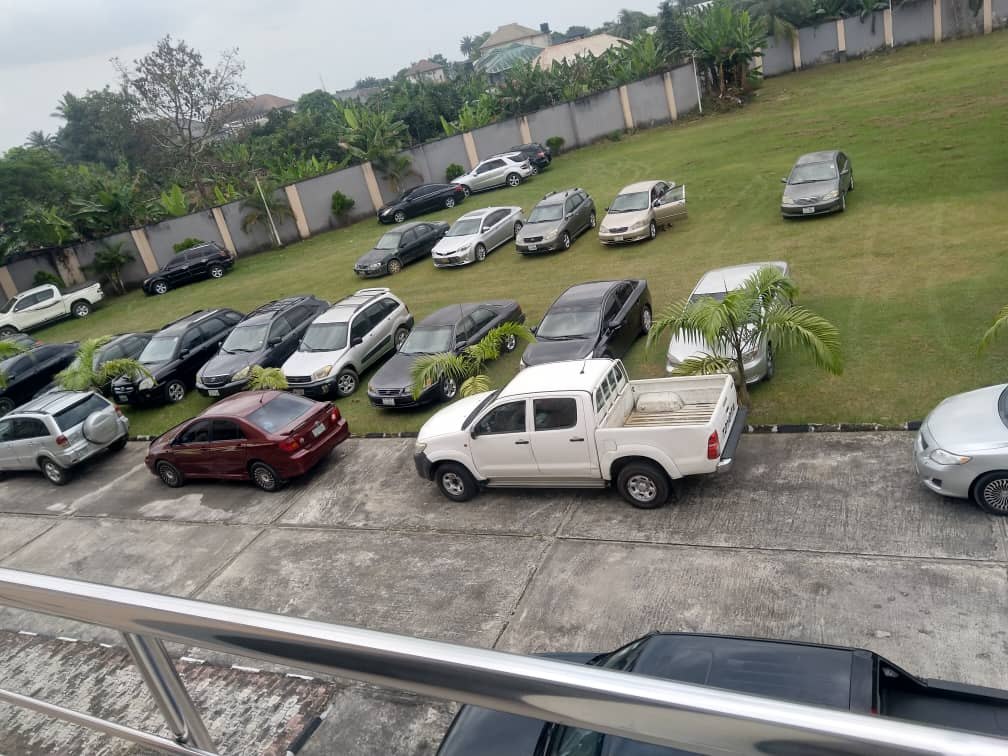 Parking space at Amunice Event Centre with cars on the compound