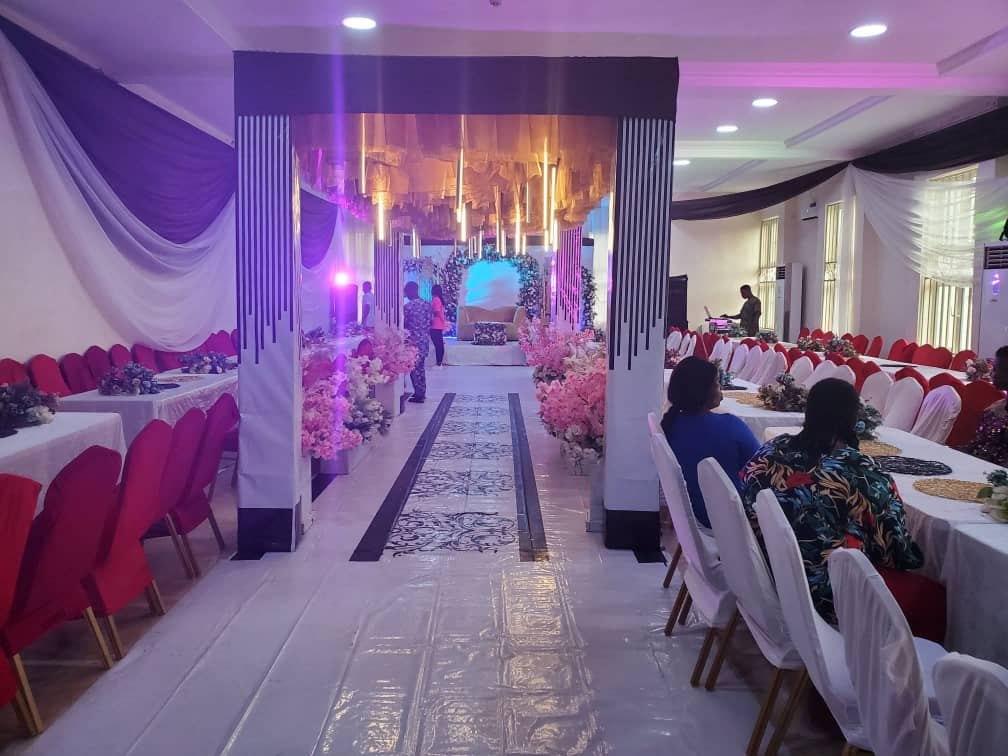 Entrance arch and flower-lined aisle