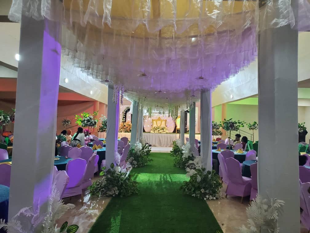 Canopy over the aisle in purple light